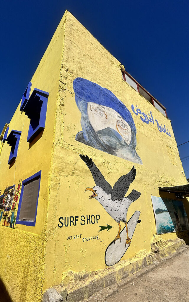 Artistic murals and colorful exterior walls in the hidden gem village of Aghroud.