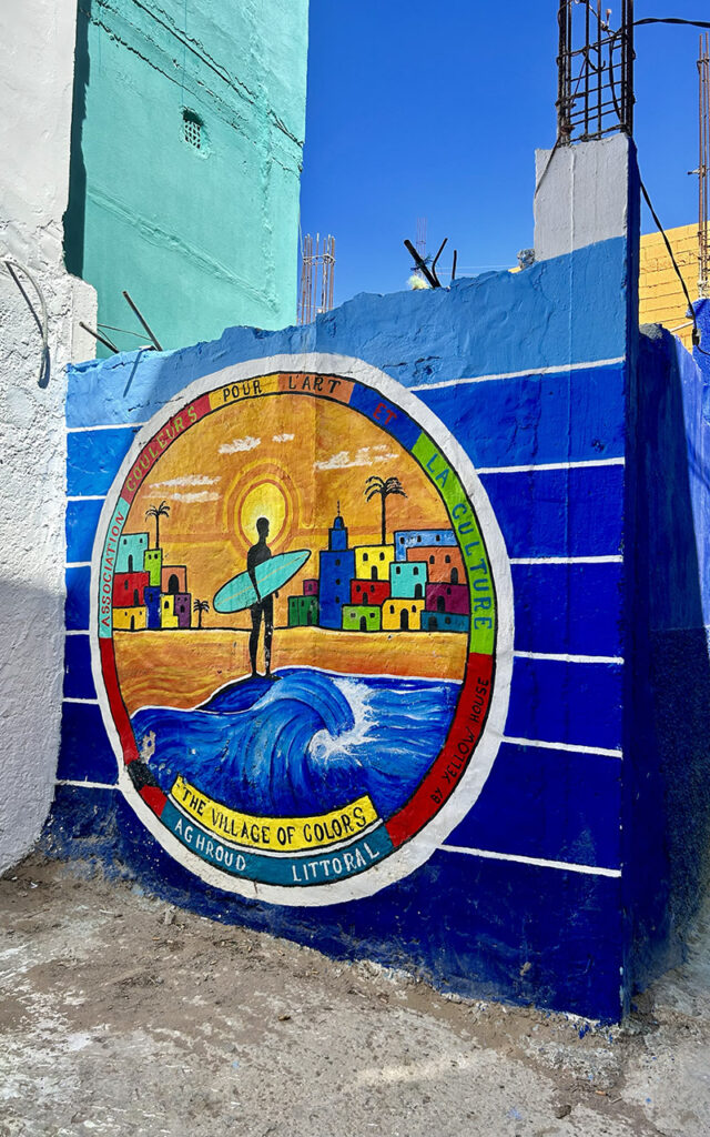 Artistic murals and colorful exterior walls in the hidden gem village of Aghroud.