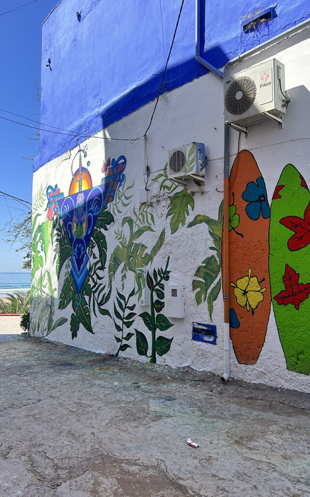 Artistic murals and colorful exterior walls in the hidden gem village of Aghroud.