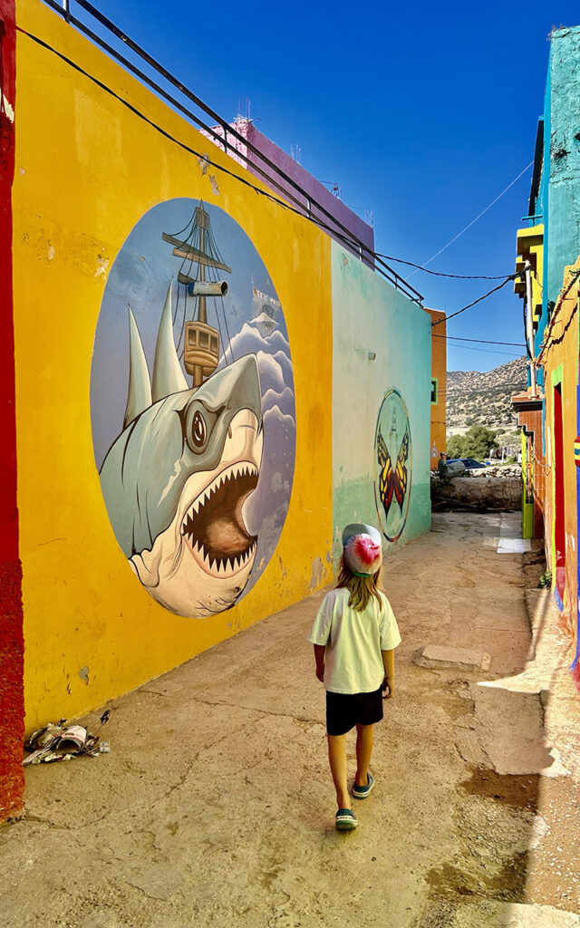 Artistic murals and colorful exterior walls in the hidden gem village of Aghroud.