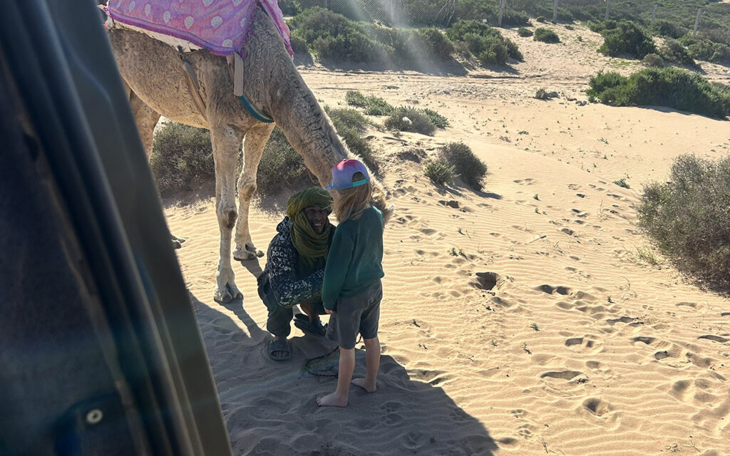 Friendly man talking to kid in Morocco