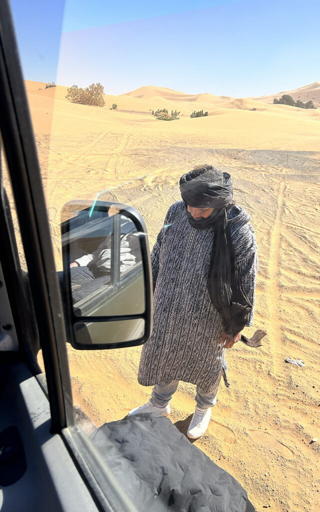 berber teaching us how to drive in desert sand