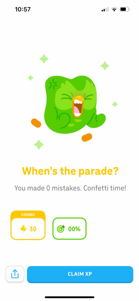 Duolingo app celebration screen showing zero mistakes and confetti after a French lesson on the road.