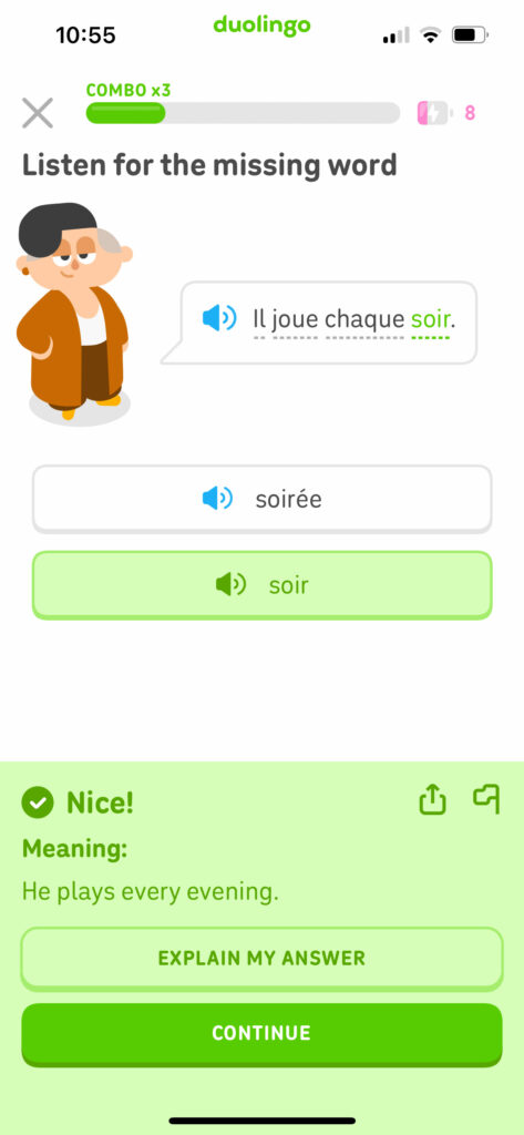 Duolingo app celebration screen showing zero mistakes and confetti after a French lesson on the road.
