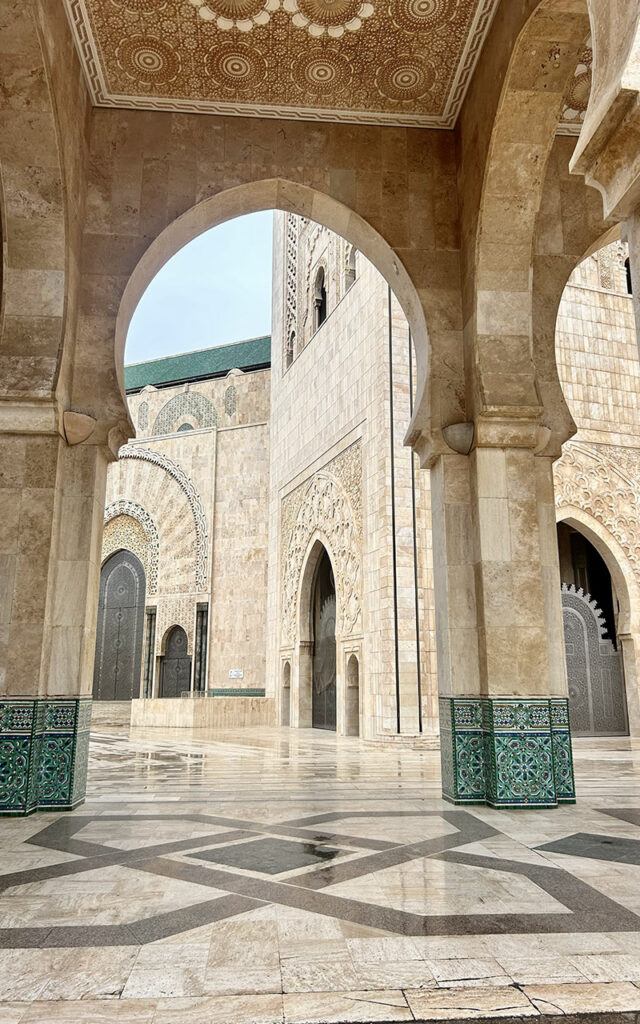 Arches and courtyard details inside Hassan II Mosque in Casablanca
