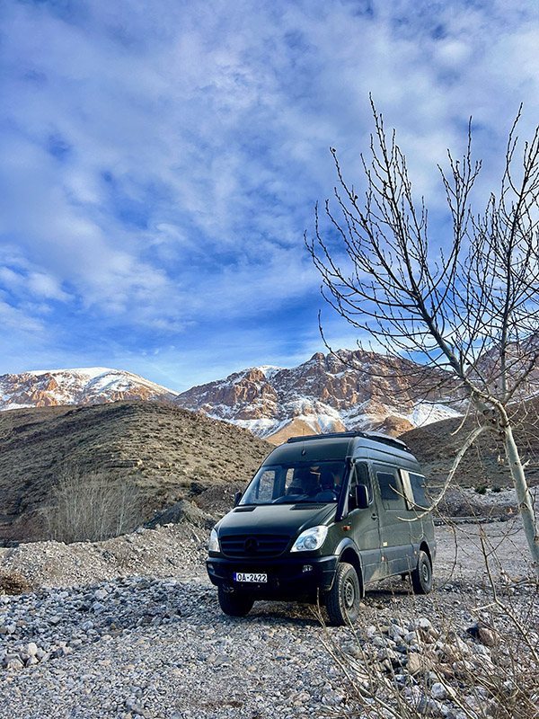 A green Sprinter camper van on an epic adventure in the Morocco